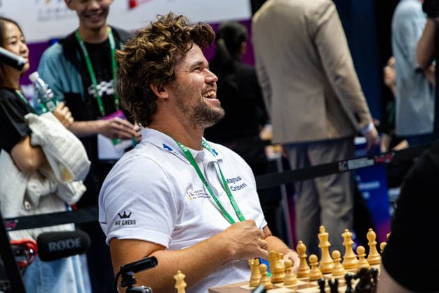 June 20, 2026, Hong Kong, Hong Kong, China: Chess Grandmaster MAGNUS CARLSEN (NOR) laughs while talking with his teammates about chess before a Blitz match at the 2026 FIDE World Team Rapid and Blitz Chess Championship in Hong Kong. Hong Kong China - ZUMAm298 0859596936st Copyright: xJamesxModestox