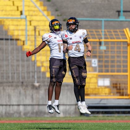 Ramsey Awuah Okine 17, Giessen Golden Dragons, and Isaac Bernard 4, Giessen Golden Dragons, during the game between the Augsburg Centurions and the Giessen Golden Dragons, American football, mens, GFL2, 2026, Matchday 7 on June 20, 2026, in Augsburg, Rosenaustadion, Bavaria, Germany,detected_source_language