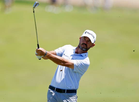Brian Harman hits an approach shot to the first hole in the third round of the 126th U.S. Open Golf Championship at Shinnecock Hills Golf Club in Southampton, NY on Saturday, June 20, 2026.  NYC202606202001 JOHNxANGELILLO