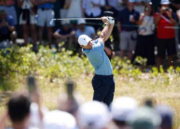 Rory McIlroy of Northern Ireland hits a tee shot on the second hole in the third round of the 126th U.S. Open Golf Championship at Shinnecock Hills Golf Club in Southampton, NY on Saturday, June 20, 2026.  NYC202606202008 JOHNxANGELILLO