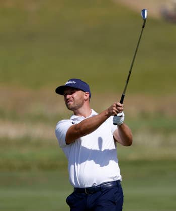 Wyndham Clark hits an approach shot to the first hole in the third round of the 126th U.S. Open Golf Championship at Shinnecock Hills Golf Club in Southampton, NY on Saturday, June 20, 2026.  NYC202606202015 JOHNxANGELILLO