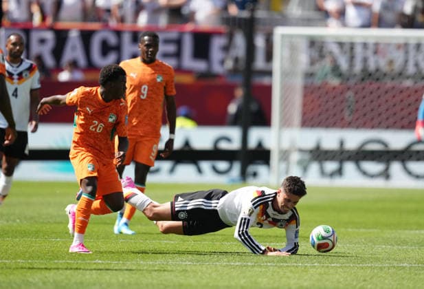 Kai Havertz of Germany and Christ Inao Oulai of Ivory Coast battle for the ball during the Germany vs. Ivory Coast match in Group E of the 2026 FIFA World Cup at Toronto Stadium in Toronto, Canada, on June 20, 2026. Photo by DeFodi Images, Thor Wegner.,detected_source_language