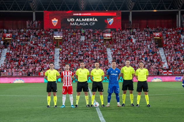 Almeria, Spain - June 20th: Captains Alfonso Herrero (N1)& Adri Embarba (N23) pose with the referee before the promotion play-off final of La Liga Hypermotion (Segunda Division) match between Almeria and Malaga at UD Almería Stadium on June 20th, 2026 in Almeria, Spain.  Copyright: xAndresxLopezxSheridanxx xSPPx Sportspressphoto_SPR171865