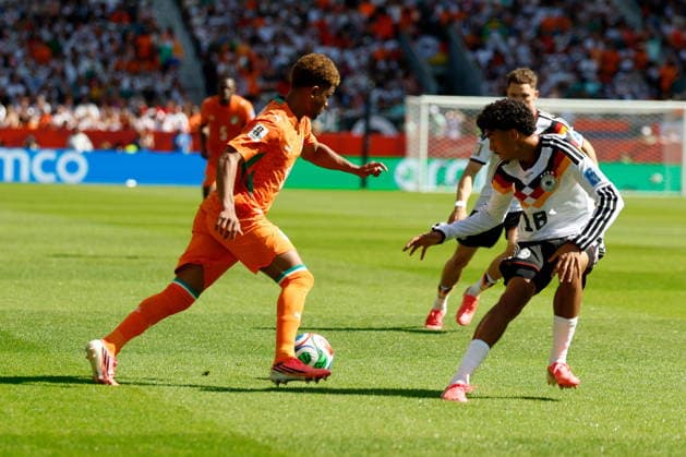 TORONTO STADIUM TORONTO ONTARIO KANADA 20.06.2026 FIFA MISTRZOSTWA SWIATA 2026 W PILKA NOZNA W KANADA MECZ GRUPA E GERMANY I COTE DIVOIRE FIFA World Cup, WM, Weltmeisterschaft, Fussball 2026 Group E match between Germany and CÃ te d Ivoire at Toronto Stadium in Toronto Canada on June 20, 2026 in Toronto, Ontario, Canada. N Z CÃ te d Ivoire midfielder Amad Diallo (15) Germany defender Nathaniel Brown (18) FOT. KAMIL KRZACZYNSKI NEWSPIX.PL --- newspix.pl POLAND OUT!  KSK