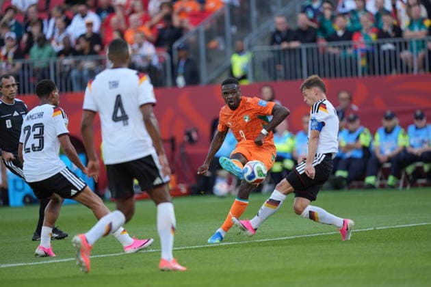 Germany v Ivory Coast - FIFA World Cup, WM, Weltmeisterschaft, Fussball 2026 - Group E TORONTO, CANADA - JUNE 20: Ange-Yoan Bonny of Ivory Coast in action against Kimmich of Germany during the 2026 FIFA World Cup First Stage Group E match between Germany and Ivory Coast at Toronto Stadium (BMO Field) in Toronto, Ontario, Canada on June 20, 2026. Mert Alper Dervis Anadolu Ontario Canada. Editorial use only. Please get in touch for any other usage.  Copyright: x2026xAnadoluxMertxAlperxDervisx