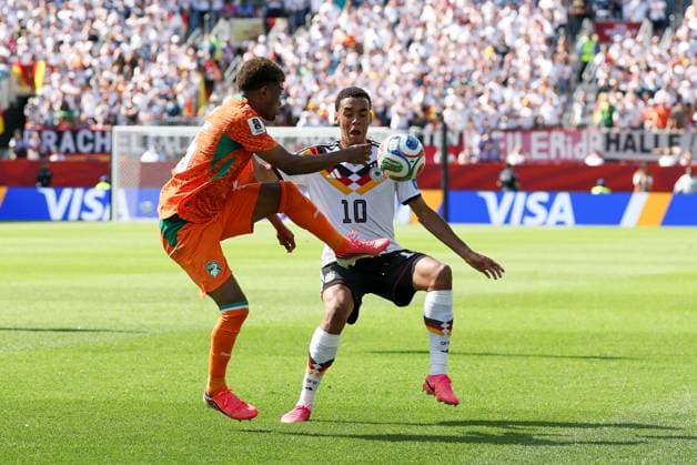 One-on-one, action, featuring Amad Diallo (15, Ivory Coast) and Jamal Musiala (10, Germany), Germany vs. Ivory Coast, soccer, FIFA, 2026 World Cup, group stage, June 20, 2026, Toronto, Ontario, Canada,detected_source_language Copyright: xkolbert-press ChristianxKolbertx
