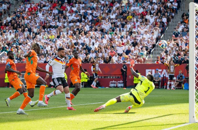 Soccer, Mens, 2026 FIFA World Cup, Group E match in Toronto, Matchday 2, Germany vs. Ivory Coast, Deniz Undav (Germany) scores the goal to tie the game at 1–1 against Franck Kessie (Ivory Coast), Odilon Kossounou (Ivory Coast), Wilfried Singo (Ivory Coast), and goalkeeper Yahia Fofana (Ivory Coast), June 20, 2026,,detected_source_language Copyright: xMatthiasxKochx