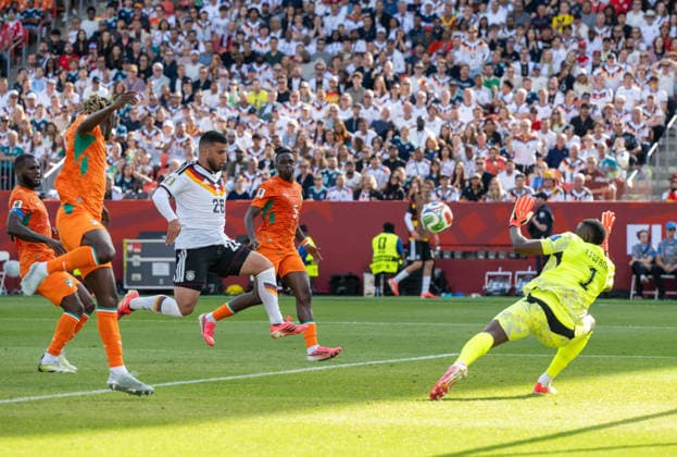 Soccer, Mens, 2026 FIFA World Cup, Group E match in Toronto, Matchday 2, Germany vs. Ivory Coast, Deniz Undav (Germany) scores the goal to tie the game at 1–1 against Franck Kessie (Ivory Coast), Odilon Kossounou (Ivory Coast), Wilfried Singo (Ivory Coast), and goalkeeper Yahia Fofana (Ivory Coast), June 20, 2026,,detected_source_language Copyright: xMatthiasxKochx
