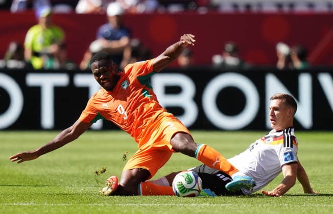June 20, 2026, Toronto, On, CANADA: Ivory Coast s Ange-Yoan Bonny (9) is tackled by Germany s Nico Schlotterbeck (15) during the first half of a World Cup Group E soccer match, in Toronto, on Saturday, June 20, 2026. Canada News - June 20, 2026  - ZUMAc35_ 20260620_zaf_c35_090 Copyright: xNathanxDenettex