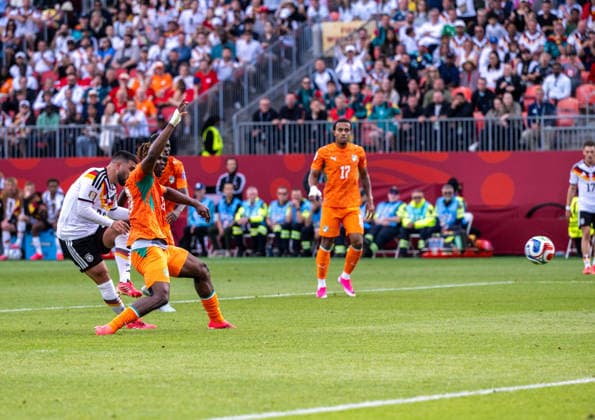 Soccer, Mens, 2026 FIFA World Cup, Group E match in Toronto, Matchday 2, Germany vs. Ivory Coast, Deniz Undav of Germany scores the goal to make it 2–1 against Emmanuel Agbadou of Ivory Coast, June 20, 2026,,detected_source_language Copyright: xMatthiasxKochx