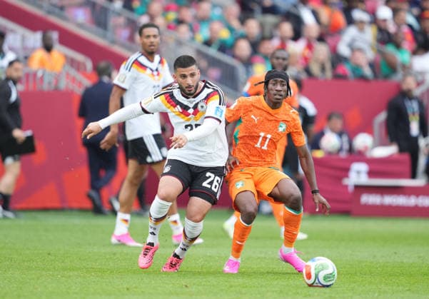 Yan Diomande of Ivory Coast and Deniz Undav of Germany battle for the ball during the Germany vs. Ivory Coast match in Group E of the 2026 FIFA World Cup at Toronto Stadium in Toronto, Canada, on June 20, 2026. Photo by Thor Wegner, DeFodi Images,detected_source_language