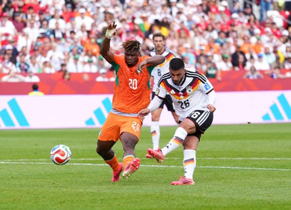 Deniz Undav of Germany, 26, shoots the ball past Emmanuel Agbadou of Ivory Coast, 20, and scores his second goal of the match. CAN, FIFA World Cup, Germany vs. Ivory Coast, Toronto, June 20, 2026, CAN, FIFA World Cup, Germany vs. Ivory Coast, Toronto, June 20, 2026, Toronto,detected_source_language Copyright: xEibner-Pressefoto ScottxColemanx EP_SCN