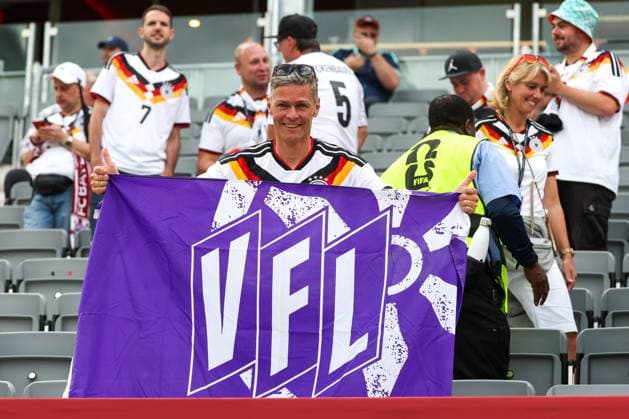 German fans here, waving a VFL Osnabrück flag, are celebrating their teams 2–1 victory in the Germany vs. Ivory Coast soccer match, FIFA, 2026 World Cup, group stage, June 20, 2026, Toronto, Ontario, Canada,detected_source_language Copyright: xkolbert-press ChristianxKolbertx