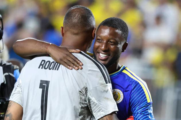 KANSAS CITY, MO - JUNE 20: Riechedly Bazoer 23 of Curacao is all smiles as he hugs Eloy Room 1 after playing to a 0-0 draw druing the FIFA World Cup, WM, Weltmeisterschaft, Fussball 2026 Group E match between Ecuador and Curacao on June 20, 2026 at Kansas City Stadium in Kansas City, MO. (Photo by Scott Winters Icon Sportswire) SOCCER: JUN 20 FIFA World Cup 26 Group E - Ecuador vs Curacao EDITORIAL USE ONLY Icon2606200760