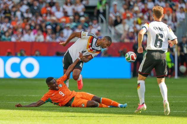 One-on-one, action, featuring Ange Yoan Bonny 9 (Ivory Coast), Jonathan Tah 4 Germany, Joshua Kimmich 6 Germany, Germany vs. Ivory Coast, soccer, FIFA, 2026 World Cup, group stage, June 20, 2026, Toronto, Ontario, Canada,detected_source_language Copyright: xkolbert-press ChristianxKolbertx
