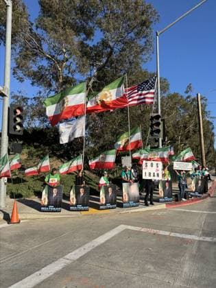 Protesters gather outside hotel hosting Iran national team, Nationalteam ahead of Belgium match LOS ANGELES, UNITED STATES - JUNE 20: Protesters gather outside the hotel hosting Iran’s national football team ahead of its 2026 FIFA World Cup, WM, Weltmeisterschaft, Fussball Group G match against Belgium, waving Iran’s former lion-and-sun flag and U.S. flags, in Los Angeles, united States, on June 20, 2026. Bozhan Memis Anadolu Los Angeles United States. Editorial use only. Please get in touch for any other usage.  Copyright: x2026xAnadoluxBozhanxMemisx