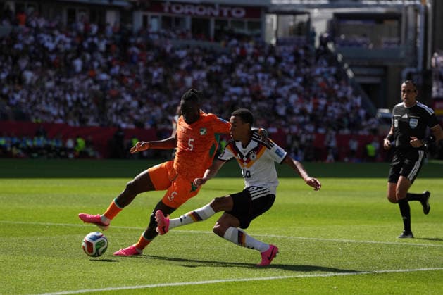 Toronto, Canada - 20 June: Jamal Musiala 10 of Germany and Wilfried Singo 5 of Cote d Ivoire in action during the FIFA World Cup, WM, Weltmeisterschaft, Fussball 2026 match between Germany vs Cote d Ivoire at Toronto Stadium on 20 June 2026. Copyright: xOPAxImagesxMohammadxKaramalix