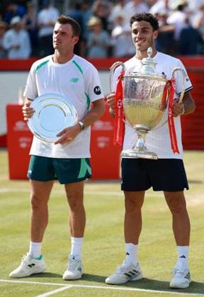 Francisco Cerundolo of Argentina celebrates with the trophy next to Tommy Paul HSBC Queen s Club Championships, Day Sixteen, Tennis, Queen s Club, West Kensington, London, UK - 21 Jun 2026London Queen s Club United Kingdom  Copyright: xEllaxLing Shutterstockx 16929308bu