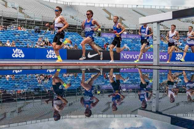 RECORD DATE NOT STATED 21st June 2026; Alexander Stadium, Birmingham, West Midlands, England; 2026 Novuna UK Athletics Championships; Runners in the men,s 5000m are reflected in the steeplechase water jump GodfreyxPitt