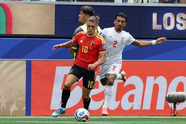 Belgium s Leandro Trossard and Iran s Saleh Hardani pictured in action during a soccer game between Belgian national team, Nationalteam Red Devils and Iran, on Sunday 21 June 2026, at the SoFi stadium in Los Angeles, the second game in the group stage of the FIFA World Cup, WM, Weltmeisterschaft, Fussball 2026 in the United States of America. The Diables Rouges - Rode Duivels were drawn into Group G. BRUNOxFAHY  x178649101x