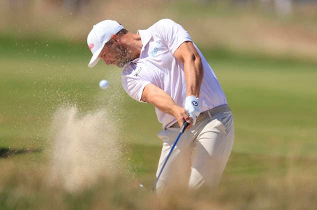 Wyndham Clark hits out of a bunker on the 4th fairway during the final round of the 126th U.S. Open Golf Championship at Shinnecock Hills Golf Club in Southampton, NY, on Sunday, June 21, 2026.  NYC20260621843 COREYxSIPKIN