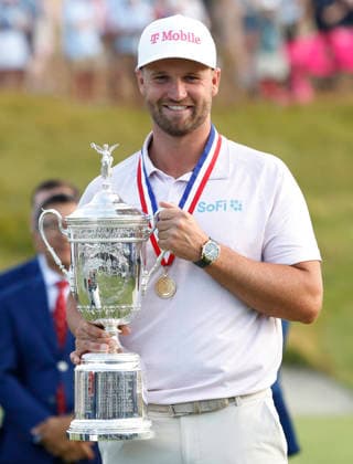 Wyndham Clark poses with the trophy after winning the 126th U.S. Open Golf Championship at Shinnecock Hills Golf Club in Southampton, NY, on Sunday, June 21, 2026. Clark won with a four-under-par score of 276.  NYC20260621921 JOHNxANGELILLO