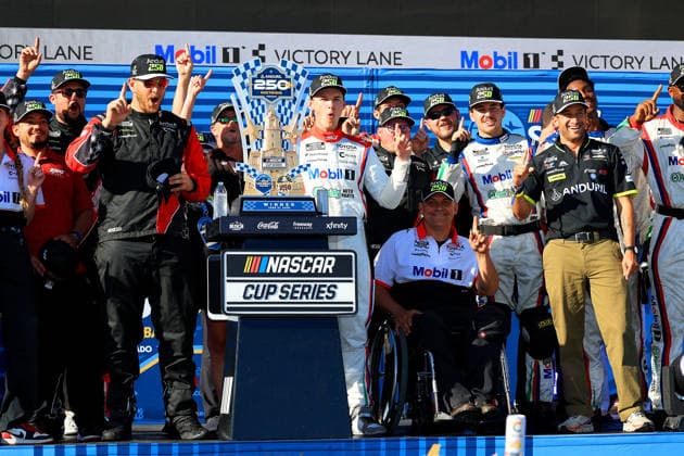 SAN DIEGO, CA - JUNE 21: Corey Heim ( 67 23XI Open MOBIL 1 O REILLY AUTO PARTS Toyota) celebrates his win in Victory Lane with his team and race sponsors after the NASCAR, Motorsport, USA Cup Series Anduril 250 Race the Base event on Sunday June 21, 2026 at the Naval Base Coronado in San Diego, CA. (Photo by David J. Griffin Icon Sportswire) AUTO: JUN 21 NASCAR Cup Series Anduril 250 Race the Base EDITORIAL USE ONLY Icon9532606211112