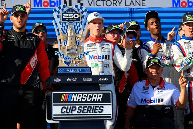 SAN DIEGO, CA - JUNE 21: Corey Heim ( 67 23XI Open MOBIL 1 O REILLY AUTO PARTS Toyota) celebrates his win in Victory Lane with his team after the NASCAR, Motorsport, USA Cup Series Anduril 250 Race the Base event on Sunday June 21, 2026 at the Naval Base Coronado in San Diego, CA. (Photo by David J. Griffin Icon Sportswire) AUTO: JUN 21 NASCAR Cup Series Anduril 250 Race the Base EDITORIAL USE ONLY Icon9532606211159