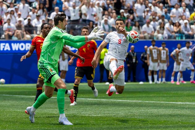 June 21, 2026, Los Angeles, California, United States: Belgium goalkeeper Thibaut Courtois (1) and IR Iran Mehdi Taremi (9) seen in action during the FIFA World Cup, WM, Weltmeisterschaft, Fussball Group G soccer match between IR Iran and Belgium at SoFi Stadium. Final score; IR Iran 0:0 Belgium Los Angeles United States - ZUMAs197 20260621_aaa_s197_300 Copyright: xRingoxChiux