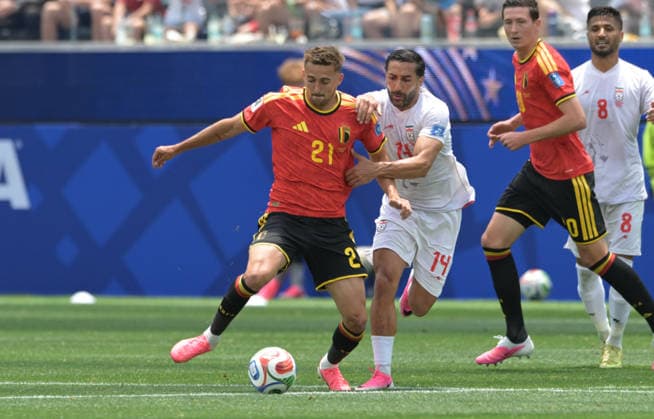Islamic Republic of Iran Vs Belgium in Los Angeles, USA - 21 Jun 2026 Timothy Castagne (L) of Belgium men football team and Saman Ghoddos (R) of IR Iran men football team seen during the FIFA World Cup, WM, Weltmeisterschaft, Fussball 2026 first stage Group G match between Belgium and Islamic Republic of Iran held at the Los Angeles Stadium. Final score: Belgium 0:0 Islamic Republic of Iran. Los Angeles United States Copyright: xLuisxVeniegrax xSOPAxImagesx 20260621_FIFAWC26_LuisVeniegra0761
