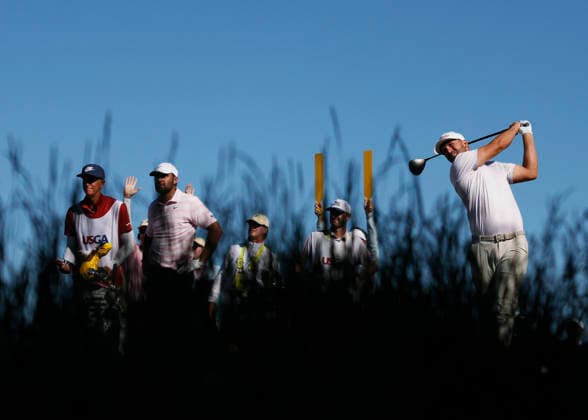Scottie Scheffler tees off on the 12th hole during the final round of the 126th U.S. Open Golf Championship at Shinnecock Hills Golf Club in Southampton, NY, on Sunday, June 21, 2026. Wyndham Clark won with championship with a four-under-par score of 276.  NYC202606213017 JOHNxANGELILLO