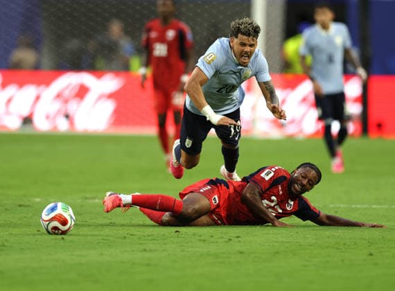 (260622) -- MIAMI, June 22, 2026 -- Maximilliano Araujo (top) of Uruguay vies with Steven Moreira of Cape Verde during the group H match between Uruguay and Cape Verde at the 2026 FIFA World Cup, WM, Weltmeisterschaft, Fussball at Miami Stadium, Miami, the United States, June 21, 2026. ) (SP)U.S.-MIAMI-FOOTBALL-FIFA WORLD CUP-GROUP H-URU VS CPV XuxZijian 