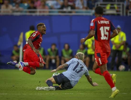 June 21, 2026, Miami Gardens, Florida, USA: Cape Verde forward Ho lio Varela (26) falls to the ground after a slide tackle from Uruguay defender Guillermo Varela (13) during the second half in their World Cup match Sunday, June 21, 2026 in Miami Gardens. Cape Verde and Uruguay ended in a 2-2 draw. Miami Gardens USA - ZUMAs70_ 0859686464st Copyright: xChrisxUrsox