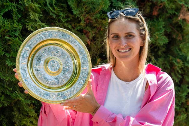 FILE PHOTO Wimbledon champion 2023 Czech tennis player Marketa Vondrousova poses for photographers with trophy during the press conference, PK, Pressekonferenz in Prague, Czech Republic, July 18, 2023. Czech tennis player Marketa Vondrousova, winner of the women s singles Wimbledon tournament in 2023, has been suspended for four years for refusing to undergo a doping test last year, the International Tennis Integrity Agency (ITIA) announced on its website today, on June 22, 2026. (CTKxPhoto OndrejxDeml) CTKPhotoP2023071803614  CTKPhotoP2023071803614
