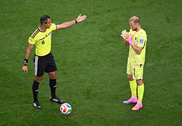 (260623) -- DALLAS, June 23, 2026 -- Goalkeeper Alexander Schlager (R) of Austria reacts as referee Amin Omar awards a penalty kick to Argentina during the group J match between Argentina and Austria at the 2026 FIFA World Cup, WM, Weltmeisterschaft, Fussball at Dallas Stadium in Dallas, the United States, June 22, 2026. ) (SP)U.S.-DALLAS-FOOTBALL-FIFA WORLD CUP-GROUP J-ARG VS AUT WuxXiaoling 