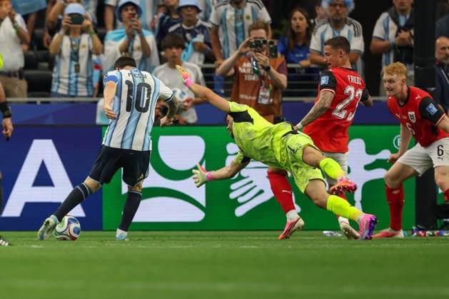 ARLINGTON, TX - JUNE 22: Lionel Messi 10 of Argentina takes a shot as Alexander Schlager 1 of Austria dives for a save attempt during the FIFA World Cup, WM, Weltmeisterschaft, Fussball 2026 Group J match between Argentina and Austria on June 22, 2026, at Dallas Stadium in Dallas, Texas. (Photo by David Buono Icon Sportswire) SOCCER: JUN 22 FIFA World Cup 26 Group J - Argentina vs Austria EDITORIAL USE ONLY Icon260622059