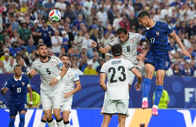 (260623) -- PHILADELPHIA, June 23, 2026 -- William Saliba (top R) of France fights for a head ball with Ibrahim Bayesh (top L) of Iraq during the group I match between France and Iraq at the 2026 FIFA World Cup, WM, Weltmeisterschaft, Fussball at Philadelphia Stadium in Philadelphia, the United States, June 22, 2026. ) (SP)U.S.-PHILADELPHIA-FOOTBALL-FIFA WORLD CUP-GROUP I-FRA VS IRQ LuixSiuxWai 