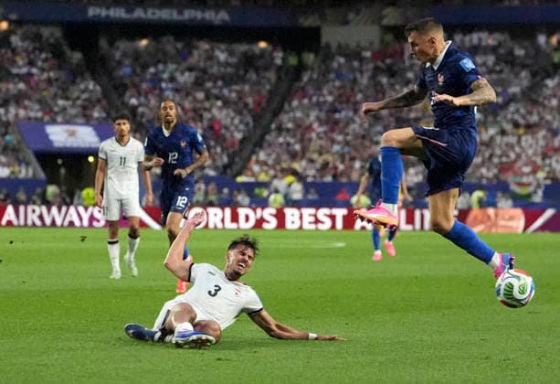 (260623) -- PHILADELPHIA, June 23, 2026 -- Lucas Digne (front R) of France vies with Hussein Ali of Iraq (front L) during the group I match between France and Iraq at the 2026 FIFA World Cup, WM, Weltmeisterschaft, Fussball at Philadelphia Stadium in Philadelphia, the United States, June 22, 2026. ) (SP)U.S.-PHILADELPHIA-FOOTBALL-FIFA WORLD CUP-GROUP I-FRA VS IRQ LuixSiuxWai 