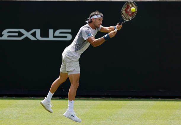 RECORD DATE NOT STATED 23rd June 2026; Devonshire Park Lawn Tennis Club, Eastbourne, East Sussex, England; Lexus Eastbourne Open Tennis, Day Three; Thiago Agustin Tirante (ARG) plays a backhand shot against Hamish Stewart (GBR) HongboxChen