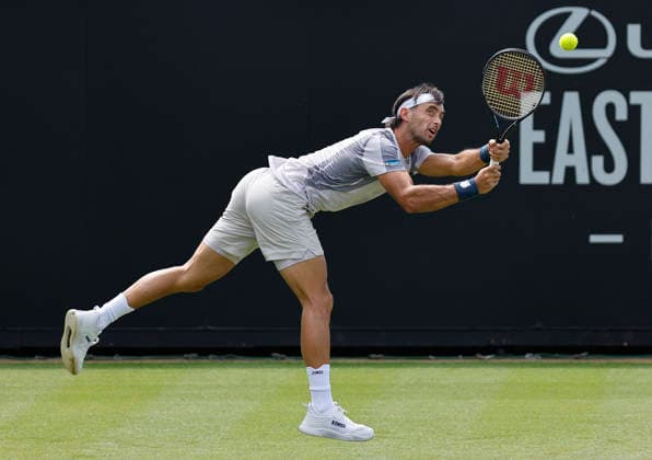 RECORD DATE NOT STATED 23rd June 2026; Devonshire Park Lawn Tennis Club, Eastbourne, East Sussex, England; Lexus Eastbourne Open Tennis, Day Three; Thiago Agustin Tirante (ARG) plays a backhand shot against Hamish Stewart (GBR) HongboxChen