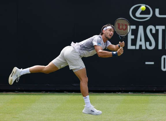 RECORD DATE NOT STATED 23rd June 2026; Devonshire Park Lawn Tennis Club, Eastbourne, East Sussex, England; Lexus Eastbourne Open Tennis, Day Three; Thiago Agustin Tirante (ARG) plays a backhand shot against Hamish Stewart (GBR) HongboxChen