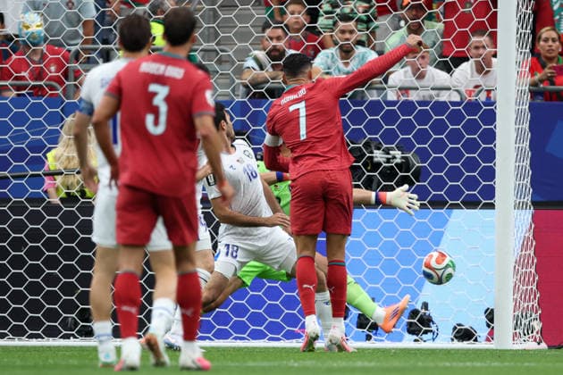 HOUSTON, TX - JUNE 23: Cristiano Ronaldo 7 of Portugal watches his goal get past Abdulla Abdullaev 18 of Uzbekistan and Abduvohid Nematov 12 of Uzbekistan during the FIFA World Cup, WM, Weltmeisterschaft, Fussball 2026 Group K match between Portugal and Uzbekistan on June 23, 2026, at Houston Stadium in Houston, Texas. (Photo by David Buono Icon Sportswire) SOCCER: JUN 23 FIFA World Cup 26 Group K - Portugal vs Uzbekistan EDITORIAL USE ONLY Icon260623015
