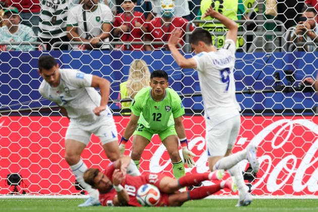 HOUSTON, TX - JUNE 23: Abduvohid Nematov 12 of Uzbekistan watches the play as his teammate Odiljon Hamrobekov 9 of Uzbekistan takes down Pedro Neto 18 of Portugal during the FIFA World Cup, WM, Weltmeisterschaft, Fussball 2026 Group K match between Portugal and Uzbekistan on June 23, 2026, at Houston Stadium in Houston, Texas. (Photo by David Buono Icon Sportswire) SOCCER: JUN 23 FIFA World Cup 26 Group K - Portugal vs Uzbekistan EDITORIAL USE ONLY Icon260623023