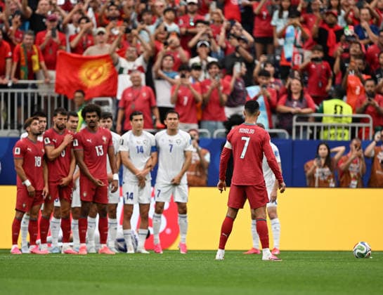 (260624) -- HOUSTON, June 24, 2026 -- Cristiano Ronaldo (front) of Portugal reacts prior to a free kick during the group K match between Portugal and Uzbekistan at the 2026 FIFA World Cup, WM, Weltmeisterschaft, Fussball at Houston Stadium in Houston, the United States, June 23, 2026. ) (SP)U.S.-HOUSTON-FOOTBALL-FIFA WORLD CUP-GROUP K-POR VS UZB XiaoxYijiu 