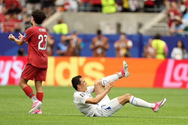(260624) -- HOUSTON, June 24, 2026 -- Otabek Shukurov (R) of Uzbekistan falls during the group K match between Portugal and Uzbekistan at the 2026 FIFA World Cup, WM, Weltmeisterschaft, Fussball at Houston Stadium in Houston, the United States, June 23, 2026. ) (SP)U.S.-HOUSTON-FOOTBALL-FIFA WORLD CUP-GROUP K-POR VS UZB LixMing 