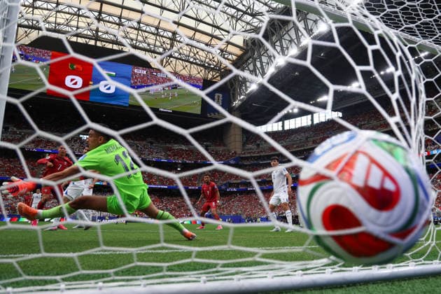 HOUSTON, TX - JUNE 23: Cristiano Ronaldo 7 of Portugal scores on Abduvohid Nematov 12 of Uzbekistan as the ball hits the back of the net during the FIFA World Cup, WM, Weltmeisterschaft, Fussball 2026 Group K match between Portugal and Uzbekistan on June 23, 2026, at Houston Stadium in Houston, Texas. (Photo by David Buono Icon Sportswire) SOCCER: JUN 23 FIFA World Cup 26 Group K - Portugal vs Uzbekistan EDITORIAL USE ONLY Icon260623064