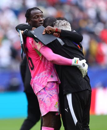Foxborough, USA, 23rd June 2026. Benjamin Asare of Ghana is hugged by coaching staff during the England vs Ghana FIFA World Cup, WM, Weltmeisterschaft, Fussball match at Gillette Stadium, Foxborough. Picture credit should read: Paul Terry Sportimage EDITORIAL USE ONLY. No use with unauthorised audio, video, data, fixture lists, club league logos or live services. Online in-match use limited to 120 images, no video emulation. No use in betting, games or single club league player publications. SPI_118_PT_Eng_Ghana SPI-4840-0124