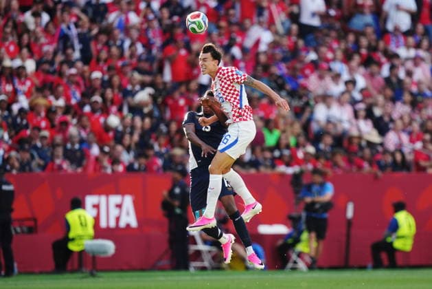 June 23, 2026, Toronto, On, CANADA: Croatia s Petar Musa (26) heads the ball over Panama s Jiovany Ramos (13) during the first half of a World Cup Group L soccer match, in Toronto, on Tuesday, June 23, 2026. Canada News - June 23, 2026  - ZUMAc35_ 20260623_zaf_c35_159 Copyright: xNathanxDenettex