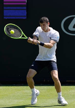 RECORD DATE NOT STATED 24th June 2026; Devonshire Park Lawn Tennis Club, Eastbourne, East Sussex, England; Lexus Eastbourne Open Tennis, Day Four; Juan Manuel Cerundoli (ARG) plays a backhand shot against Arthur Fery (GBR) HongboxChen