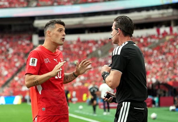 FIFA World Cup, WM, Weltmeisterschaft, Fussball 2026 - Group B - Switzerland vs Canada Granit Xhaka of Switzerland argues with the referee Ramon Abatti of Brazil during the FIFA World Cup 2026 group stage match Switzerland against Canada, in Vancouver, Canada, 24 June 2026. VANCOUVER Canada  Copyright: xBOBxFRIDx